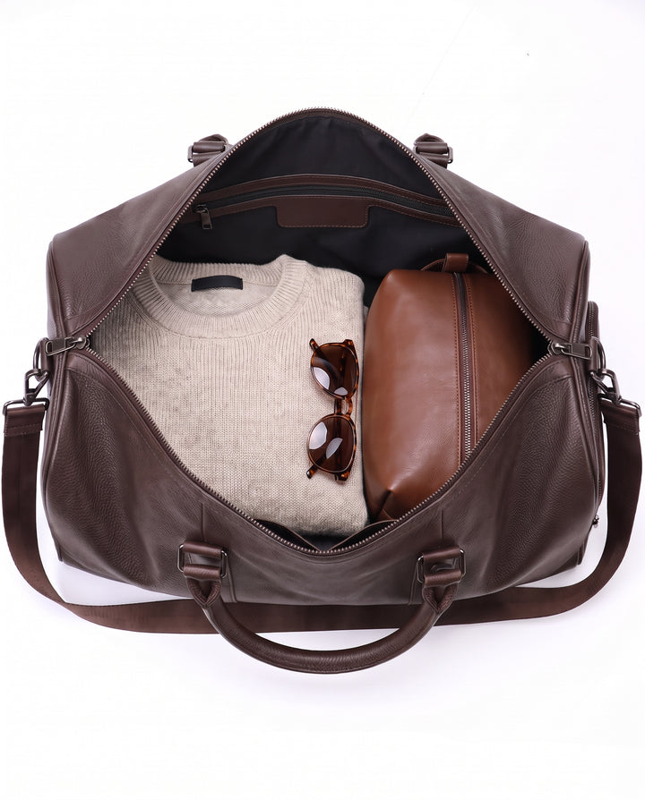 The Gstaad 44 leather travel bag in brown, interior and pockets