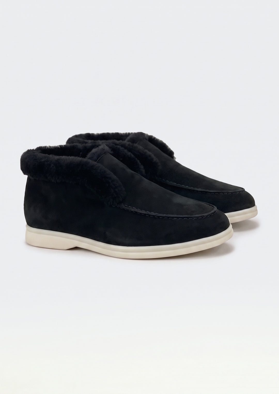 Courchevel Shearling Loafers in Black, pair on a light grey studio background