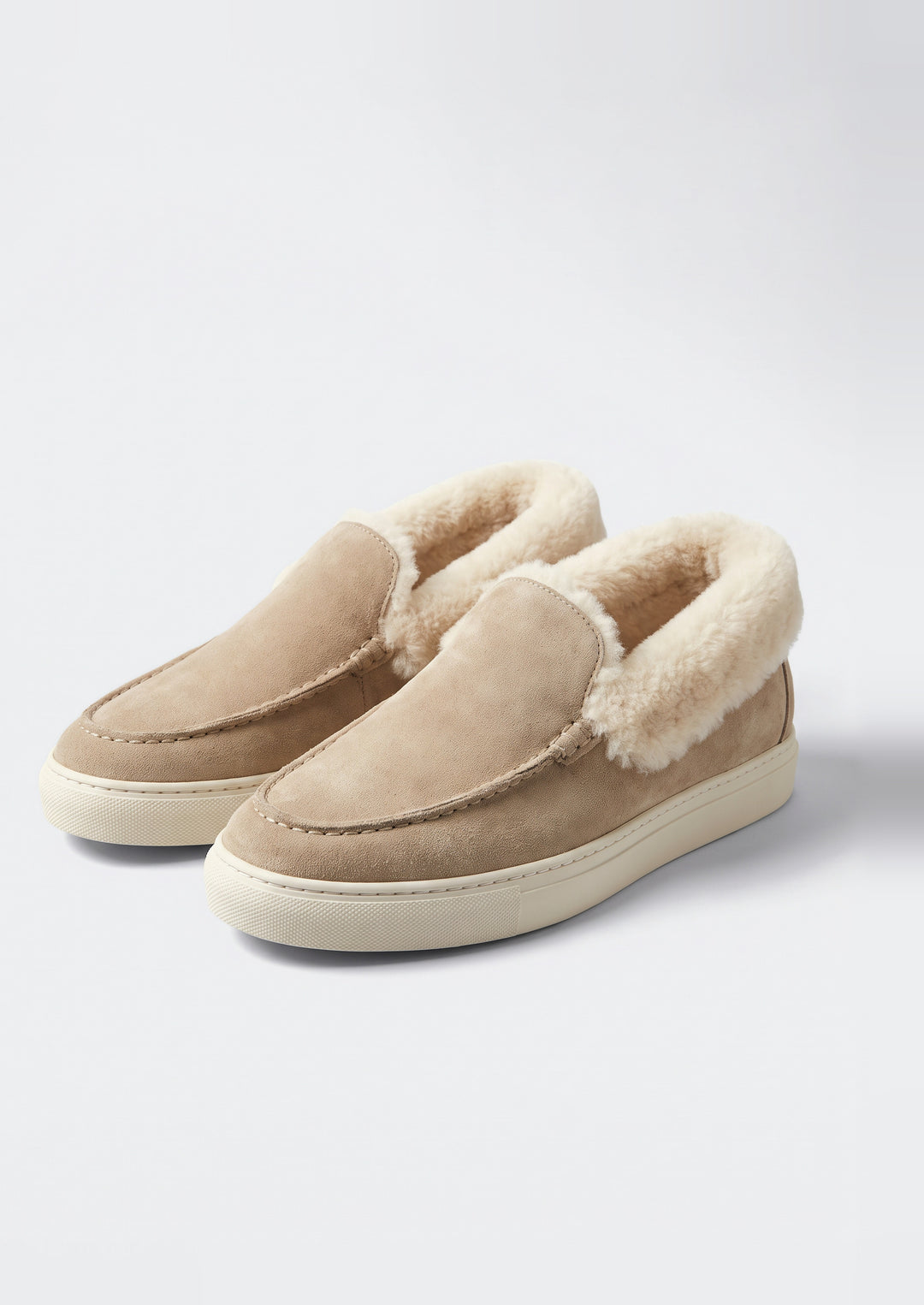 Courchevel Shearling Loafers in Stone, pair on a light grey studio background
