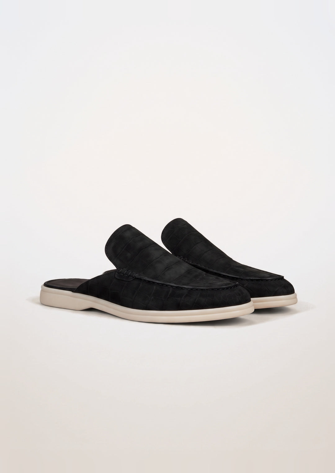 Porto Cervo Croc Mules in Black, pair on a light grey studio background
