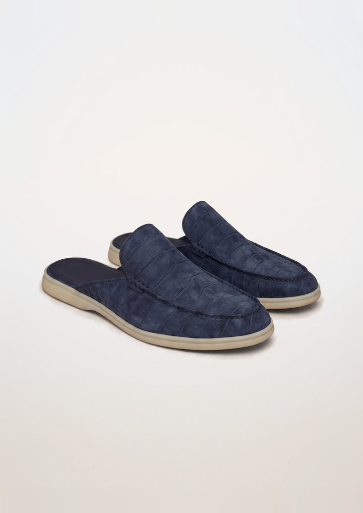 Porto Cervo Croc Mules in Navy, pair on a light grey studio background