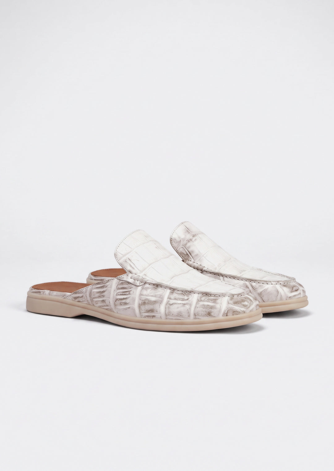 Porto Cervo Croc Mules in White, pair on a light grey studio background