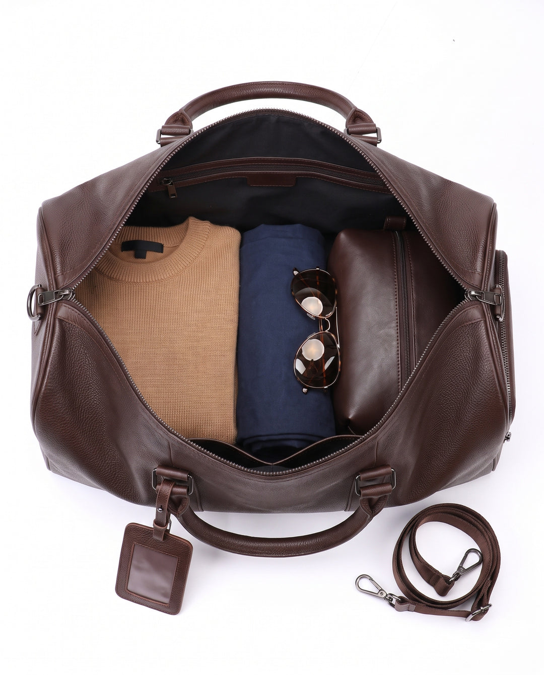 The Gstaad 55 leather travel bag in brown, interior and pockets
