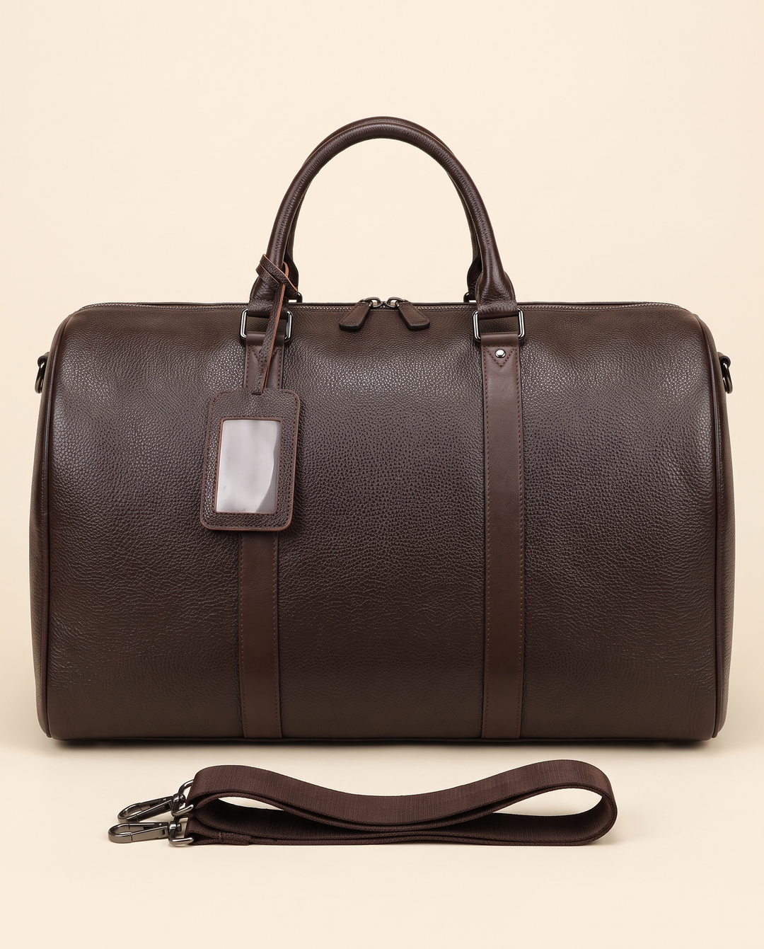 The Gstaad 55 leather travel bag in brown, front with the shoulder strap