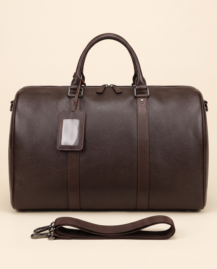 The Gstaad 55 leather travel bag in brown, front with the shoulder strap