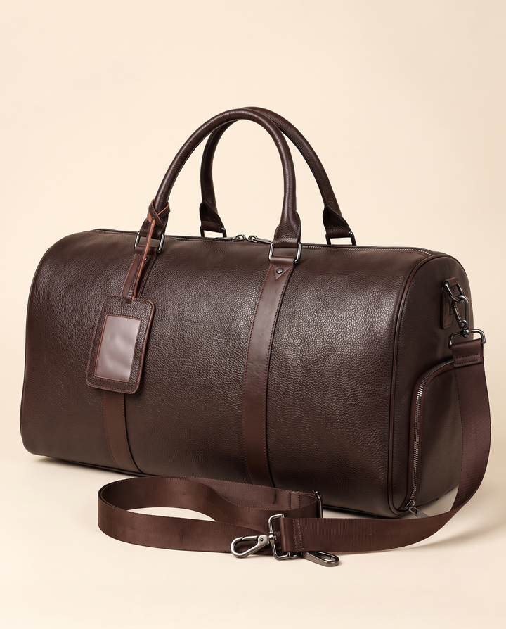The Gstaad 55 leather travel bag in brown, three-quarter view