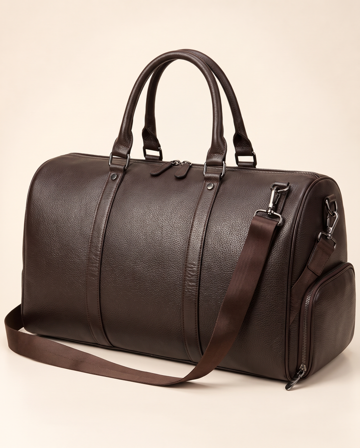 The Gstaad 44 leather travel bag in brown, three-quarter view
