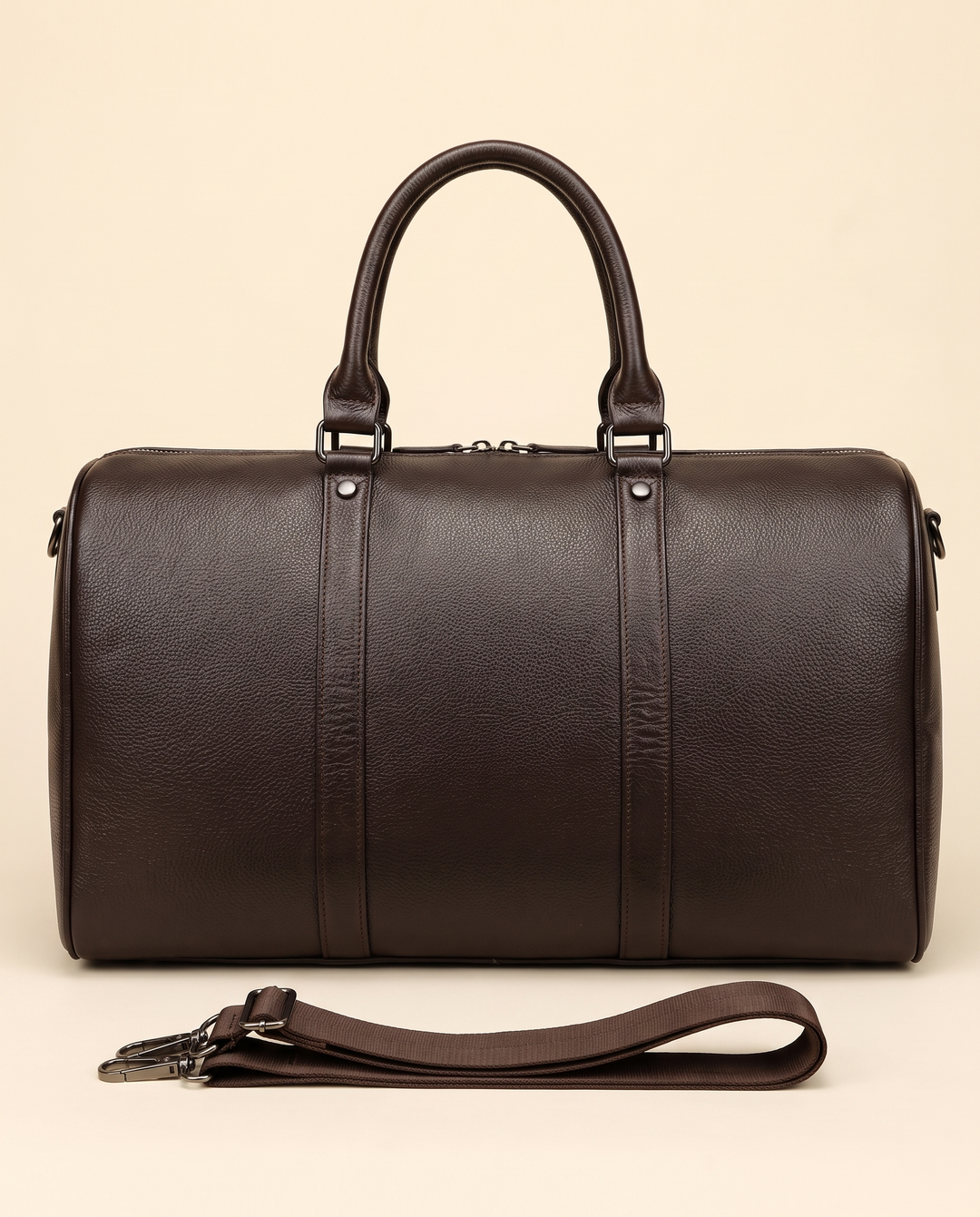 The Gstaad 44 leather travel bag in brown, front with the shoulder strap