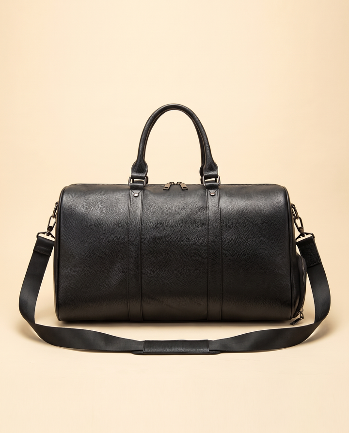 The Gstaad 44 leather travel bag in black, front with the shoulder strap