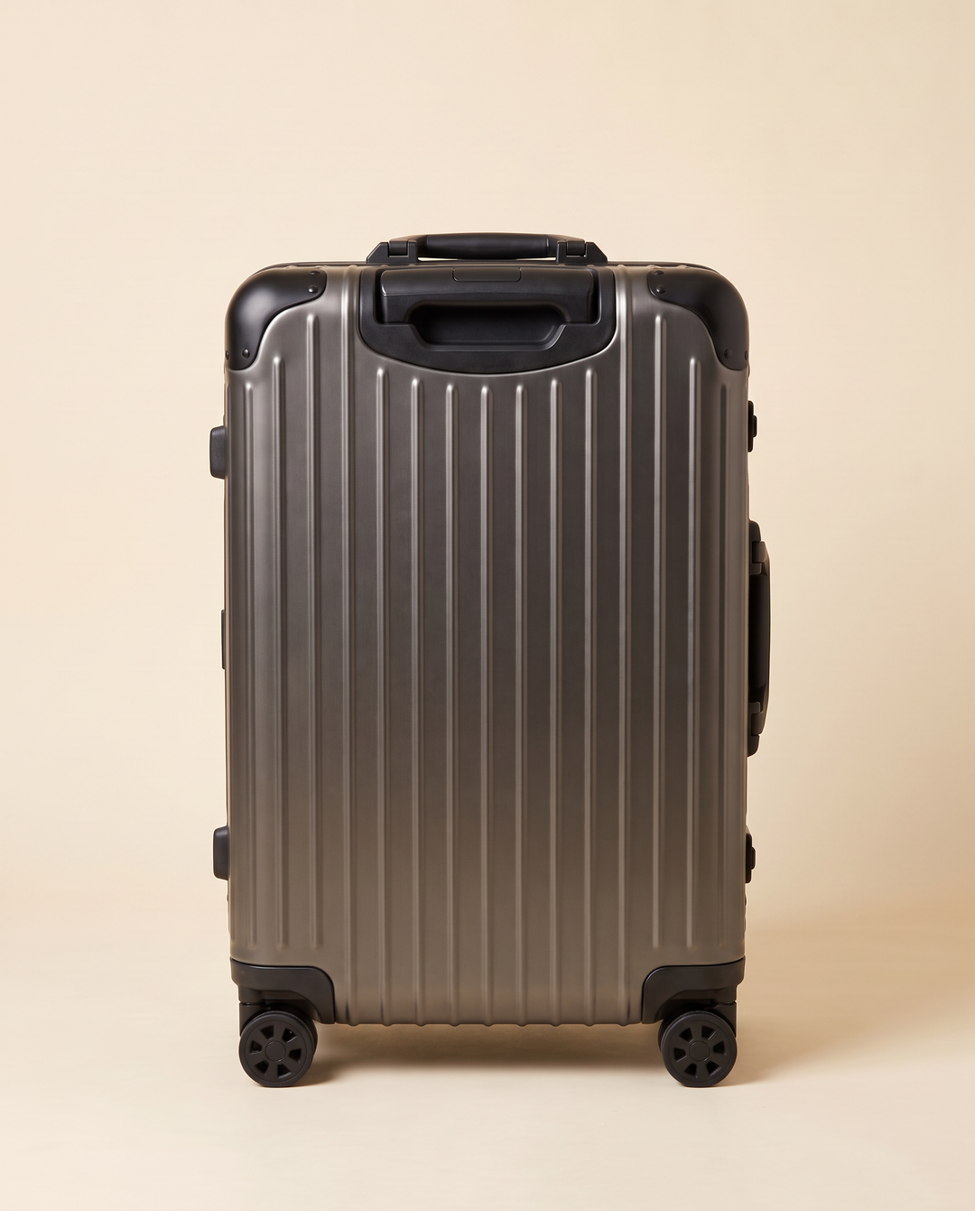 The Verbier aluminum suitcase in gunmetal, front view