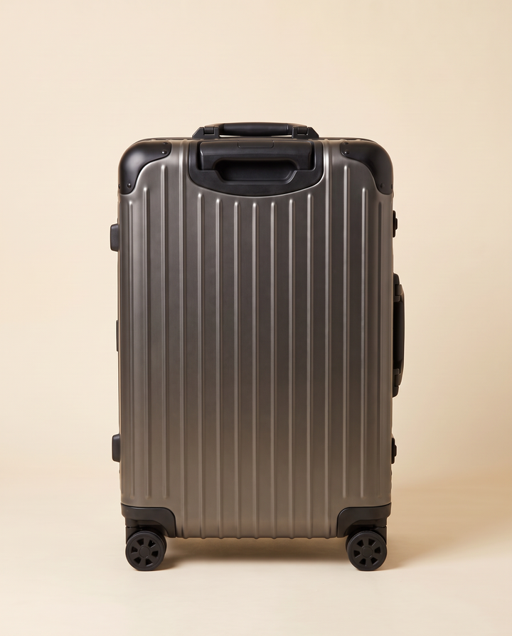 The Verbier aluminum suitcase in gunmetal, front view