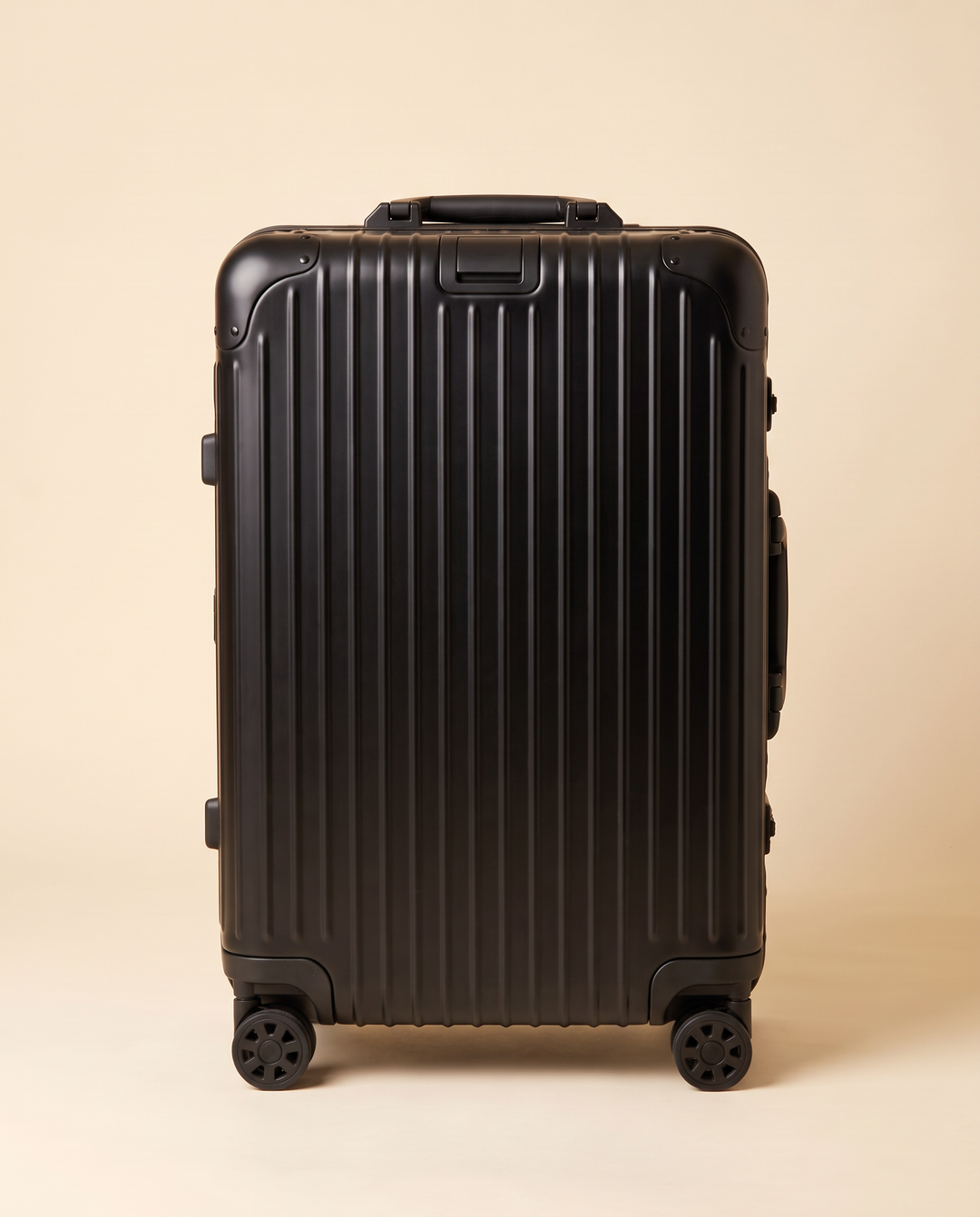 The Verbier aluminum suitcase in black, front view
