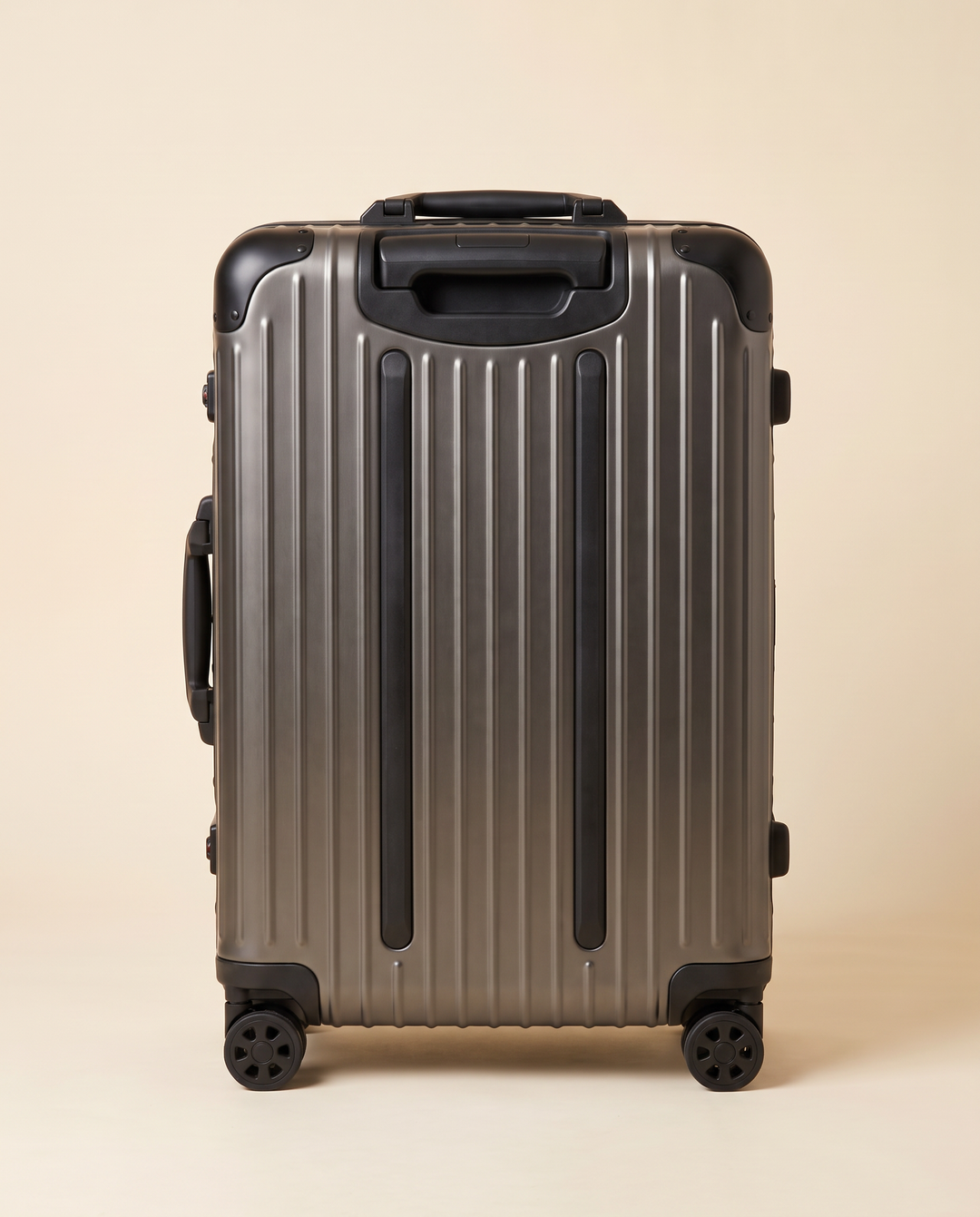 The Verbier aluminum suitcase in gunmetal, back view