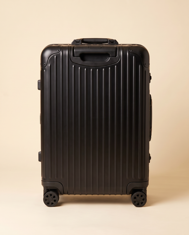 The Verbier aluminum suitcase in black, back view