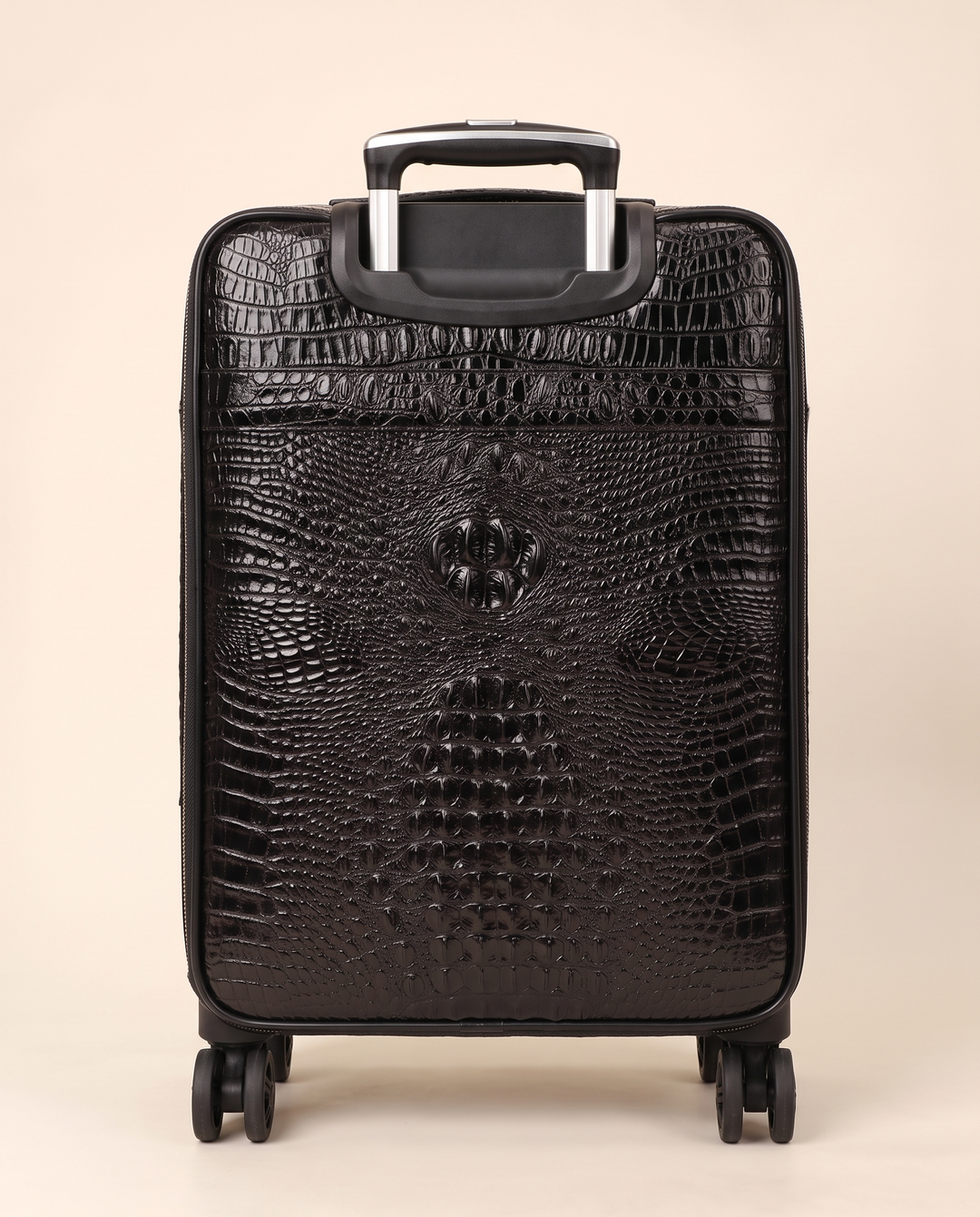 The Zermatt 58 crocodile trolley case in black, back view
