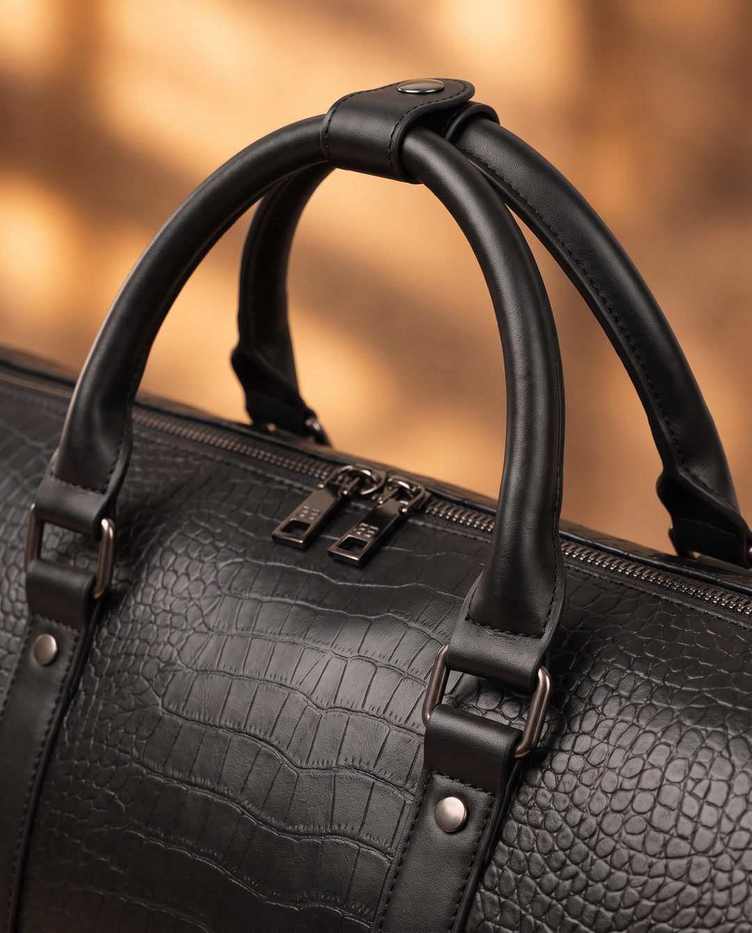 The Lucerne 50 croc weekender in black, detail close-up