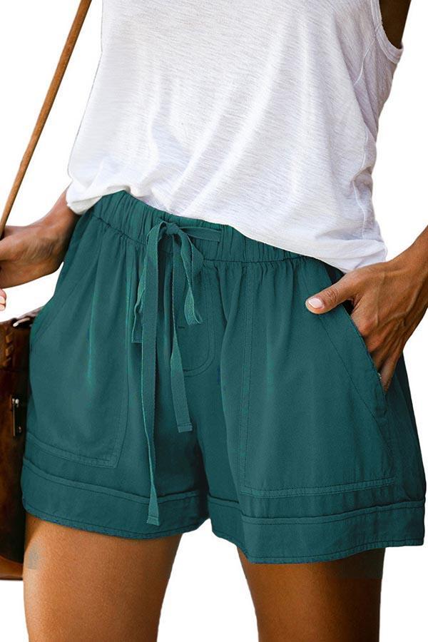 Pantalones casuales con cordón y bolsillos laterales sólidos con paneles